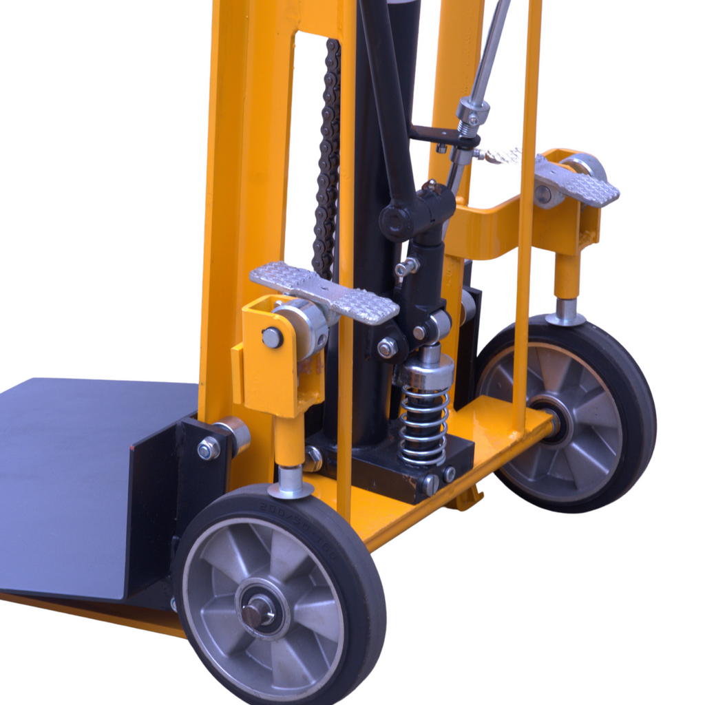 Close-up of a yellow hydraulic pallet jack featuring wheels, pedals, and a lifting mechanism for transporting heavy loads.