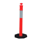 A tall, traffic bollard with a bright red top, silver reflective band, and a black base, used for directing traffic.