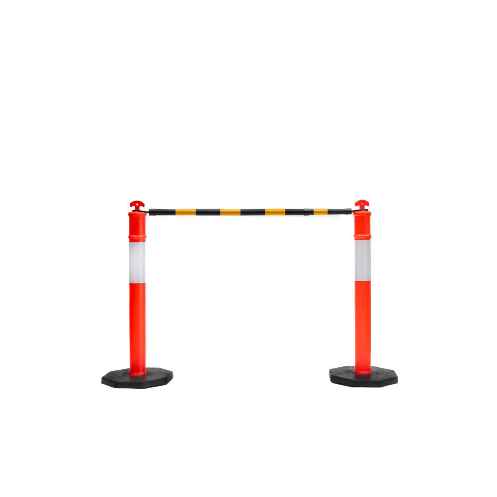 Two red and white traffic barriers with a black and yellow striped tape overhead, preventing passage in a clear space.