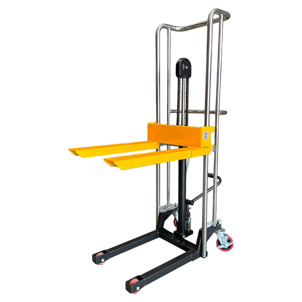 A compact yellow and black manual stacker with two forks, designed for lifting and moving materials in a warehouse setting.