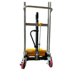 Front view of a hydraulic hand truck with chrome metal frame, yellow hydraulic pump, and red rubber wheels for easy mobility.