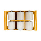 A yellow frame holding six white rollers, designed for material handling.
