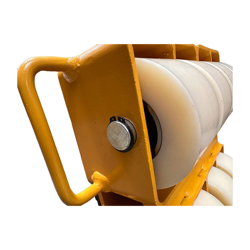 Close-up of a yellow heavy-duty industrial roller with white plastic wheels, featuring a metal handle and fastening mechanism.