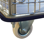 Close-up of a chrome and blue utility cart wheel, showcasing its sturdy construction and smooth-rolling white plastic wheel.