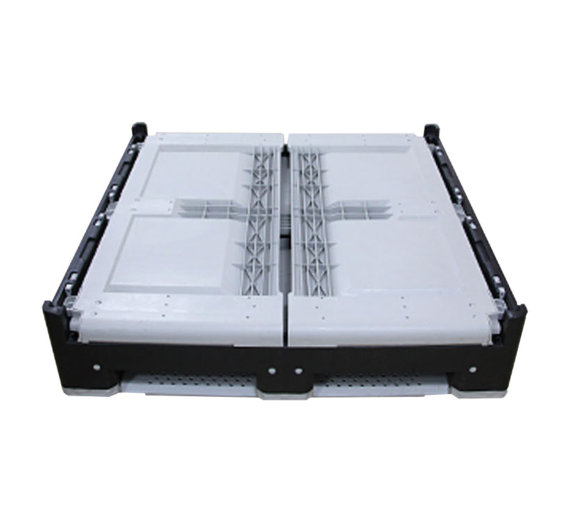 A collapsed, sturdy, large plastic container with a black frame and white base, designed for industrial storage and transport.