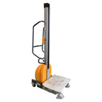 A compact powered lifter stacker with a yellow base, silver mast, and a flat loading platform on wheels for easy mobility.