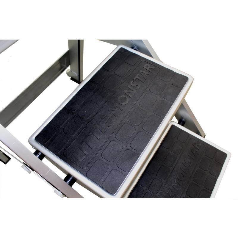 Close-up of a step ladder's rubberized treads, featuring the embossed text "LITTLE MONSTAR" on the steps.