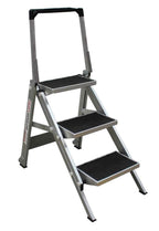 A grey aluminum step ladder with three textured steps and a handle for stability, positioned against a white background.