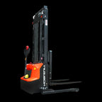 A modern orange and black electric stacker with a lifting mast and forks, designed for material handling in warehouses.