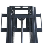 Close-up view of a forklift's mast, featuring chains and hydraulic components for lifting heavy loads.