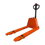 An orange pallet jack with a black ergonomic handle and measuring gauges on both forks, designed for lifting and transporting goods.