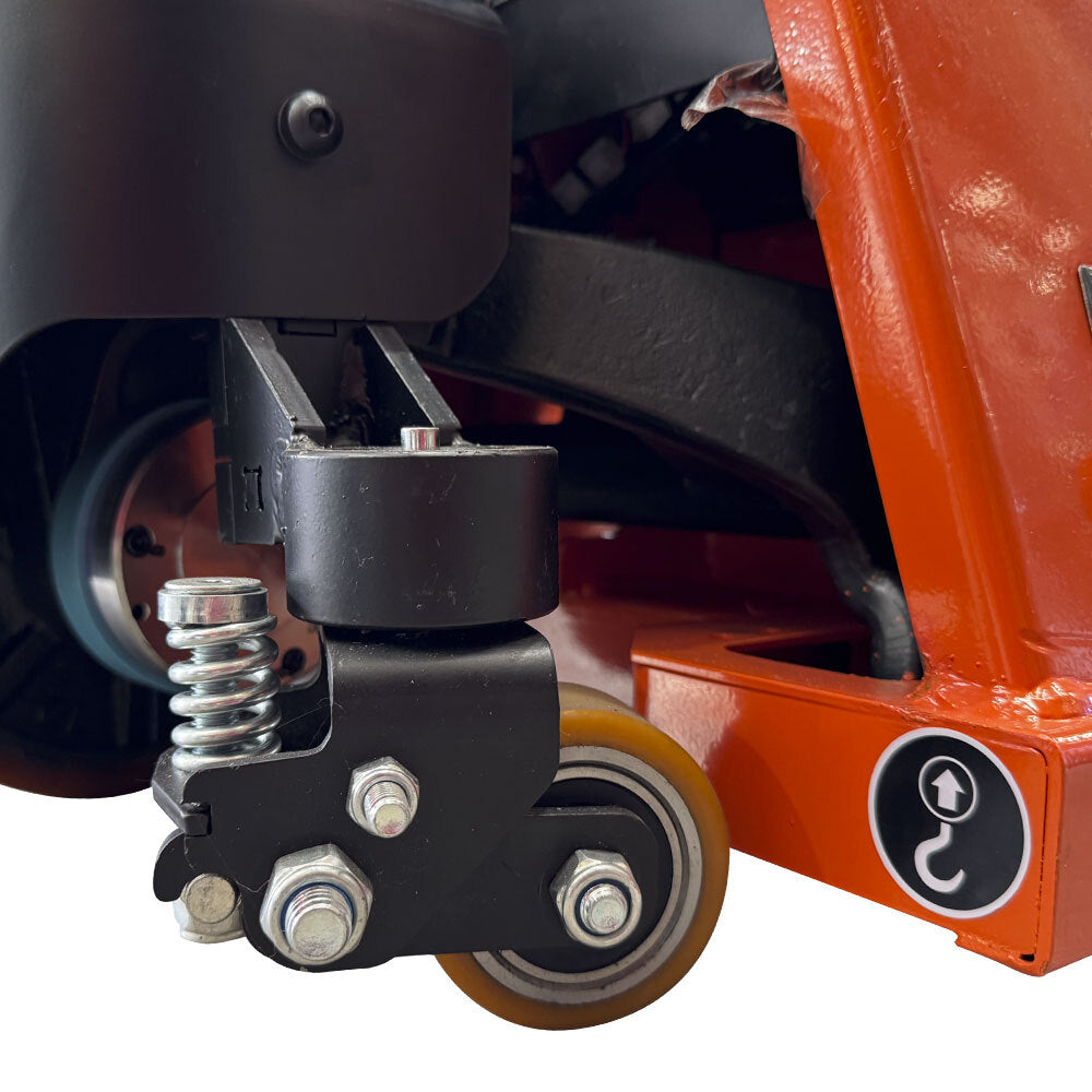 Close-up of a black wheeled swivel caster with a spring, part of a lift mechanism, showing detailed components and an orange base.