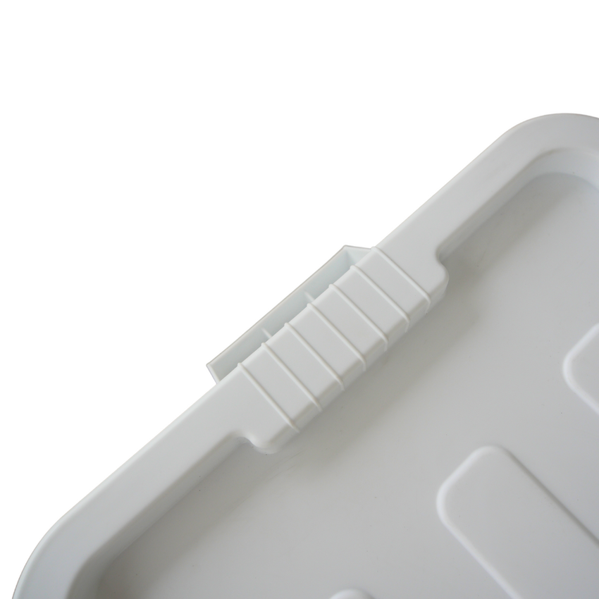 Close up of a white storage container ribbed lid design where the handle grip is located.