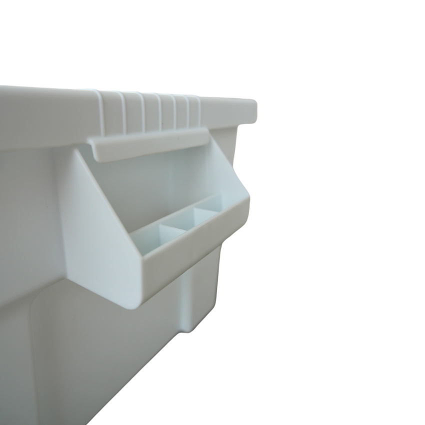 Close up of a white storage containers side handle, showcasing the width and easiness to grip.