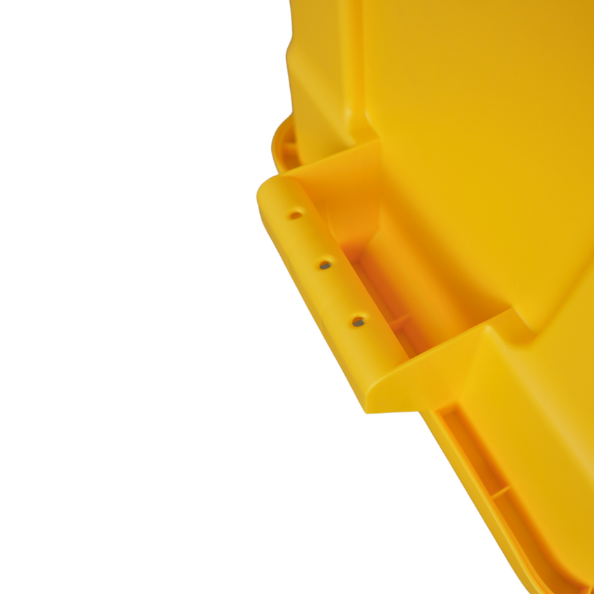 Close of of an upside down yellow storage container showcasing the underneath of the handle grip.