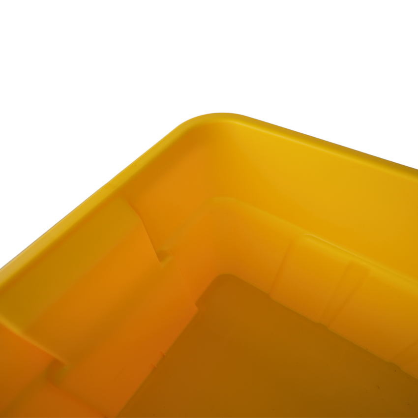 Close-up of a yellow plastic storage container, showcasing its smooth corners and bottom design with grid patterns.