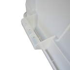 Close-up of a clear plastic container, showing the side handle.