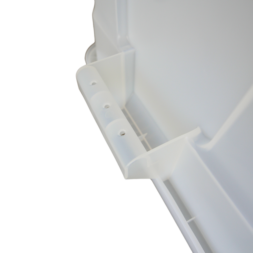 Close-up of a clear plastic container, showing the side handle.