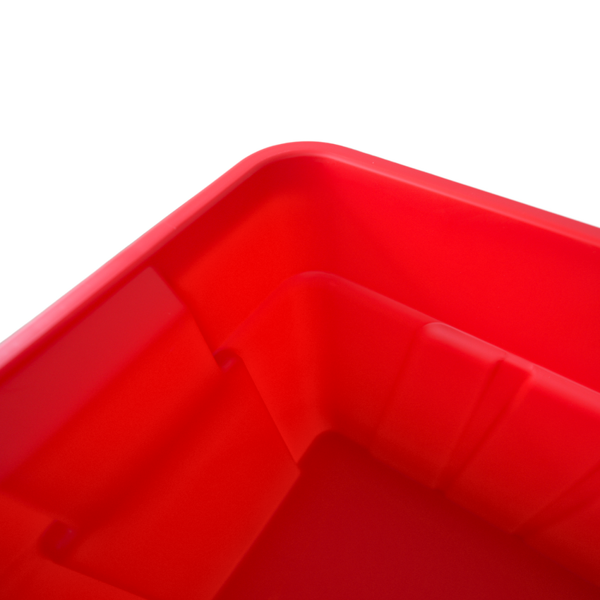 Close-up of a vibrant red plastic storage bin, showcasing its smooth interior and rounded corners against a white background.