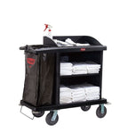 Black housekeeping trolley with 4 wheels, a side bin bag, cleaning supplies on top, and white towels across two shelves.