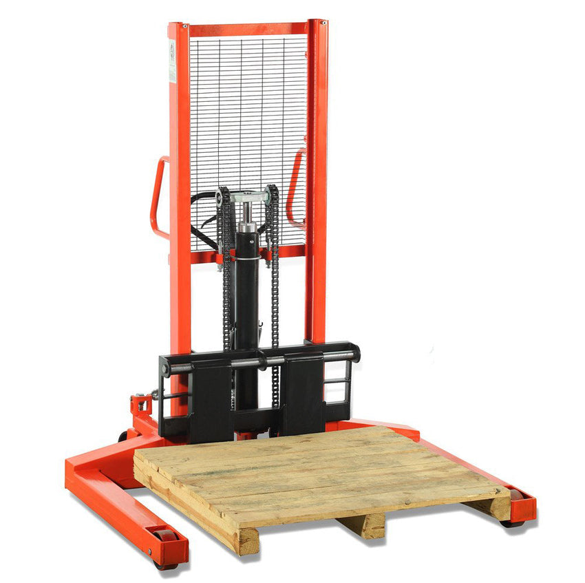 A red manual pallet stacker with a raised hydraulic lift, holding a wooden pallet, is positioned on a white background.