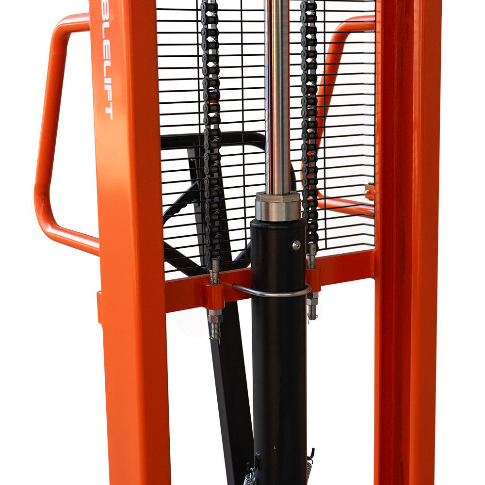 Close-up of an orange heavy-duty lift with hydraulic components and chains, designed for elevating and moving heavy objects.