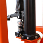 Close-up of a pallet stacker's hydraulic spring mechanism and lever, highlighting its sturdy construction.