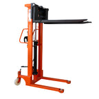 An orange manual stacker with black forks lifted all the way up, used for lifting and transporting pallets.