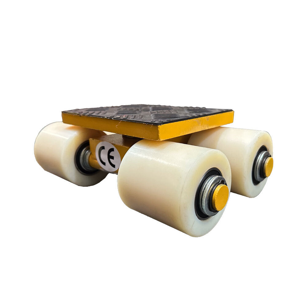 A small, sturdy dolly with a textured black surface and four white wheels, ideal for moving heavy items effortlessly.