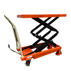 A bright orange scissor lift table with a sturdy black frame and wheels, designed for elevating heavy items in workshops.