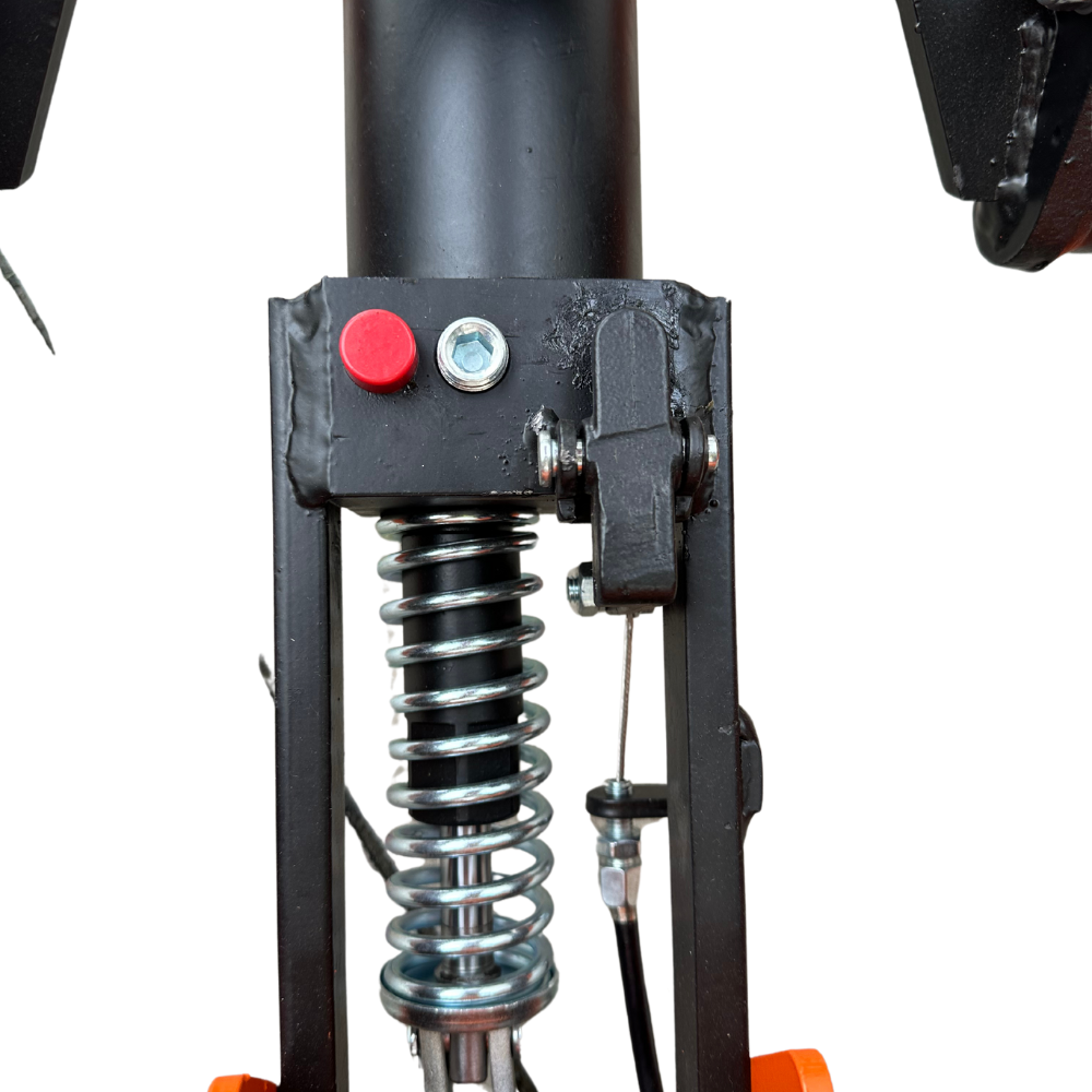 Close-up of a mechanical assembly featuring a red button, metallic spring, and connectors, highlighting a compact design for machinery.