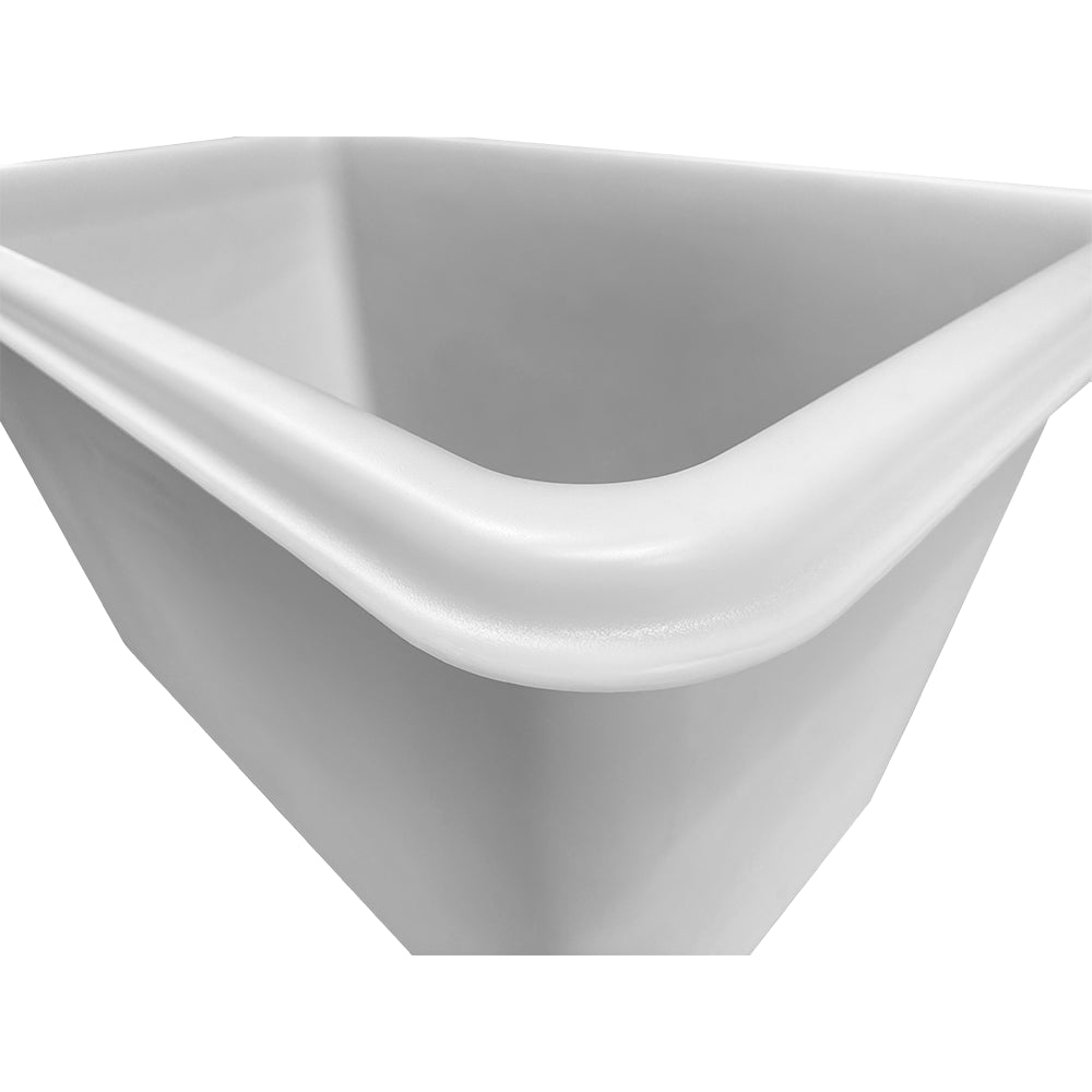 Close-up of a clean, white rectangular container with smooth edges and a slightly curved top, viewed from an angle.